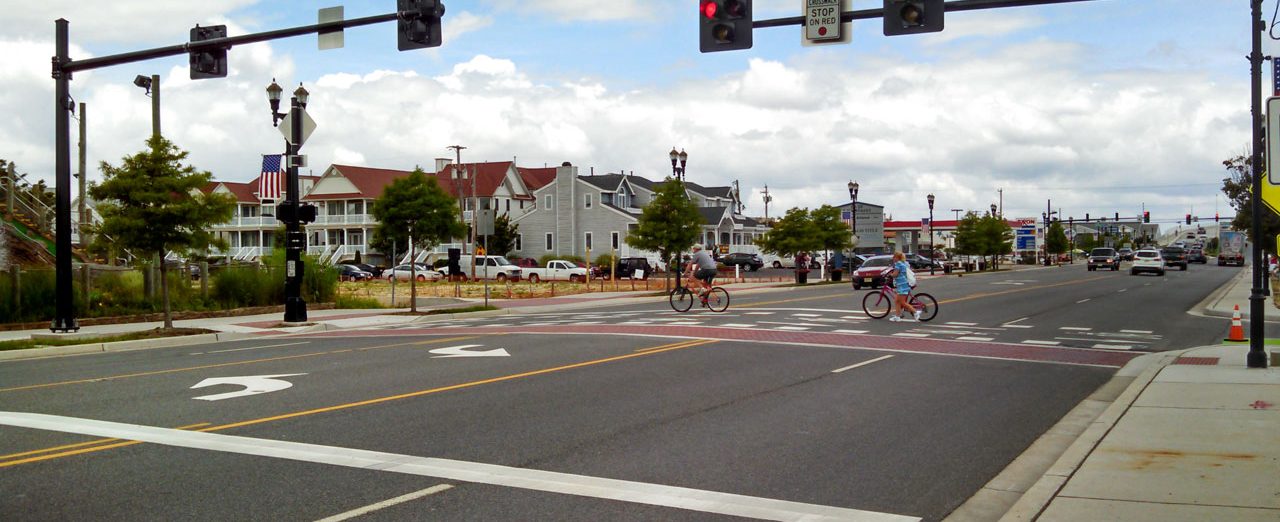 Bicyclists cross traffic intersection