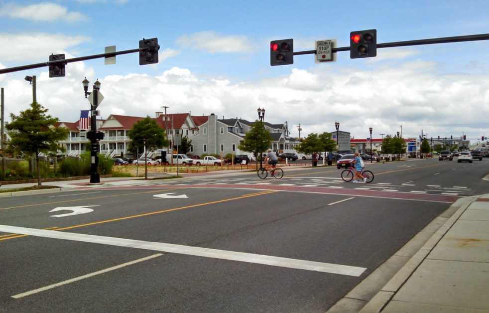Bicyclists cross traffic intersection