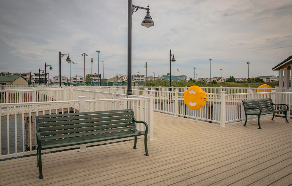 Benches, lights and flotation devices on pier