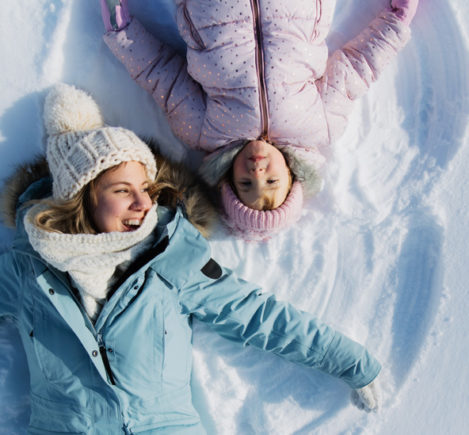 Making snow angels during winter