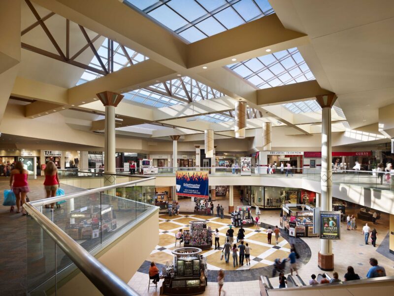 Community of shoppers walking around Rockaway Mall.