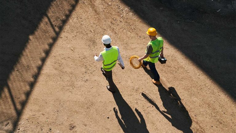 men walking on construction site