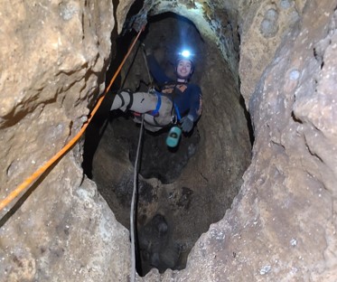 Nick Gladstone within Karst Region cave