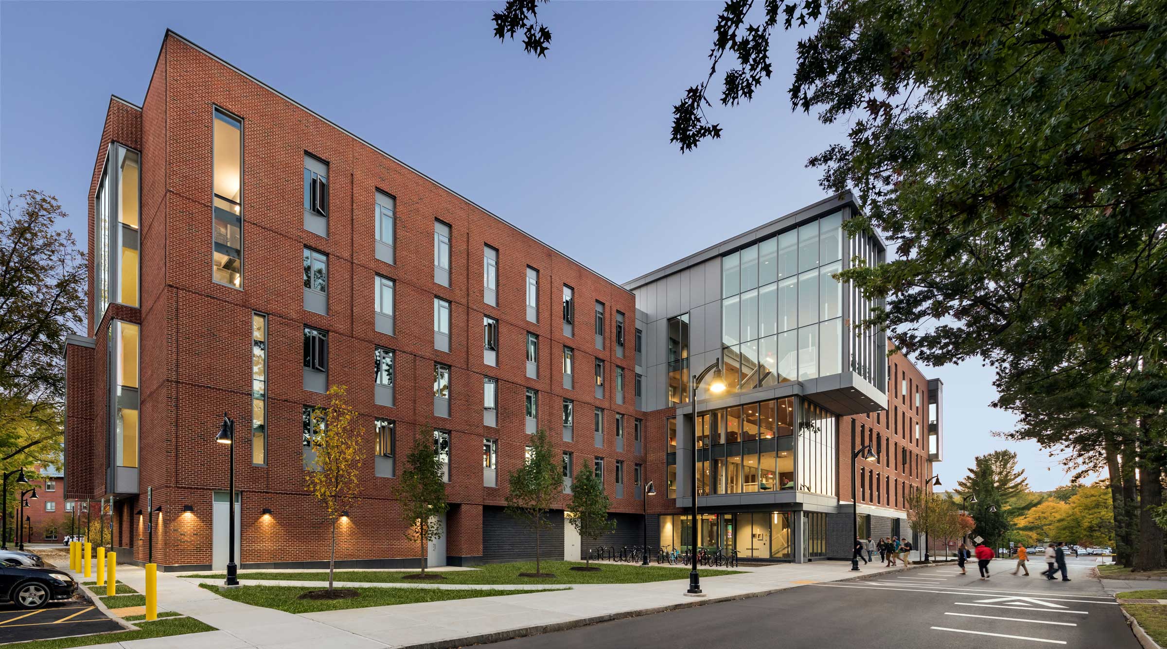 Students walking outside of Living and Learning Commons at Keene State College.