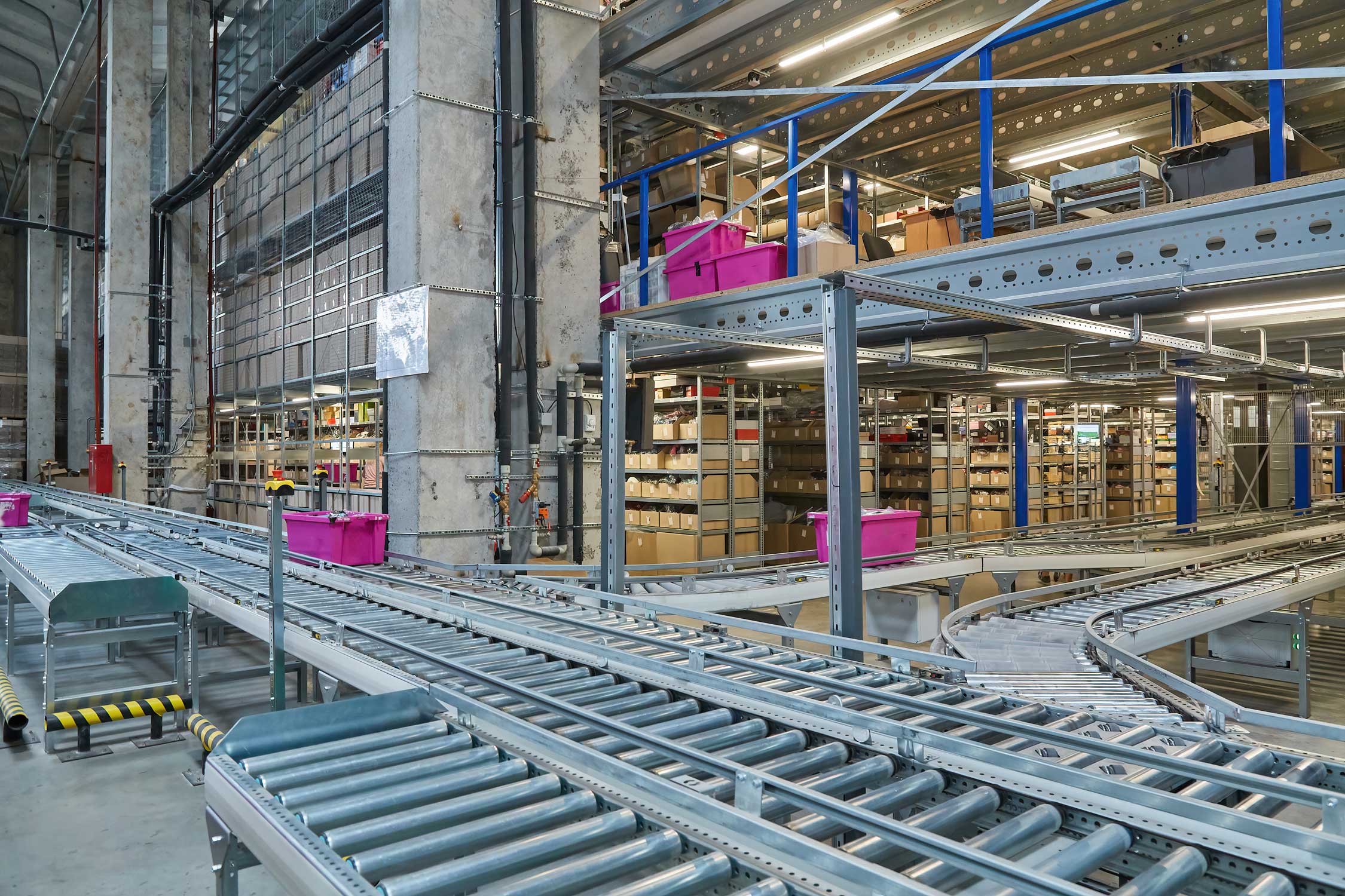 Automated conveyor system with product bins moving from one place to another.