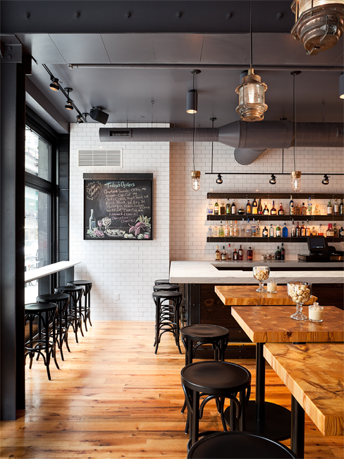 Brett Webber Architects - Sansom Street Oyster House interior consists of tables, bar, counter and stools.