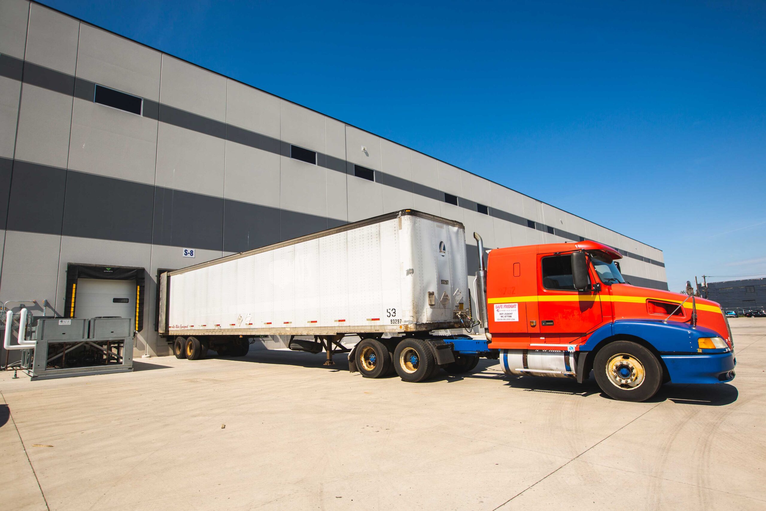 Red and white truck parked in terminal at Penford Newark.