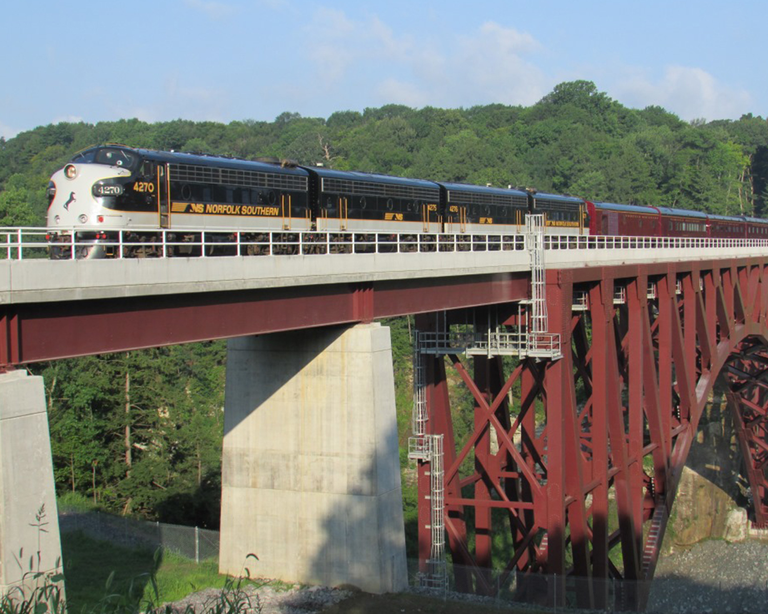 Train going across rail bridge