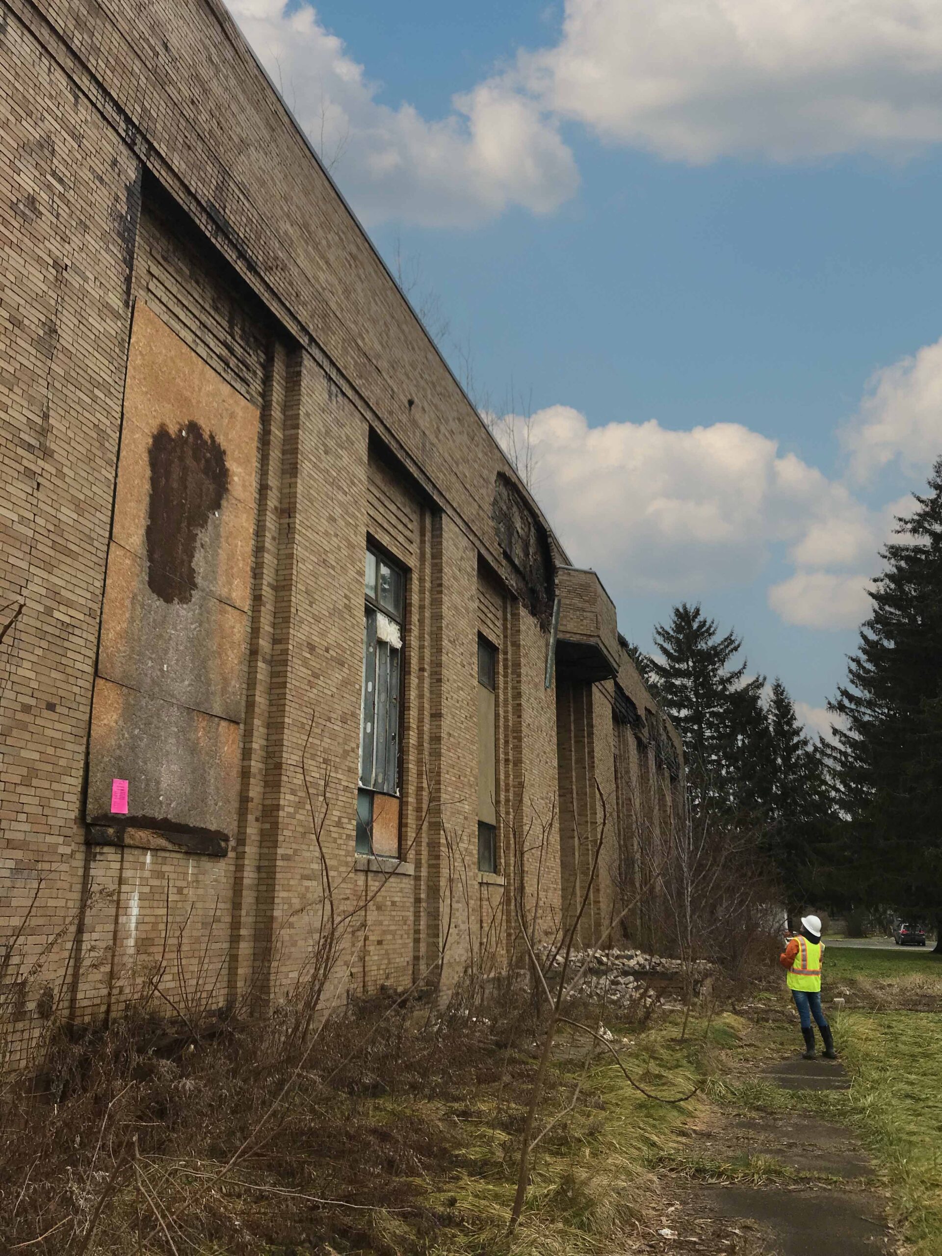 Cultural resources professional inspects abandoned structure
