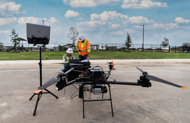 UAS pilots check drone equipment before flight