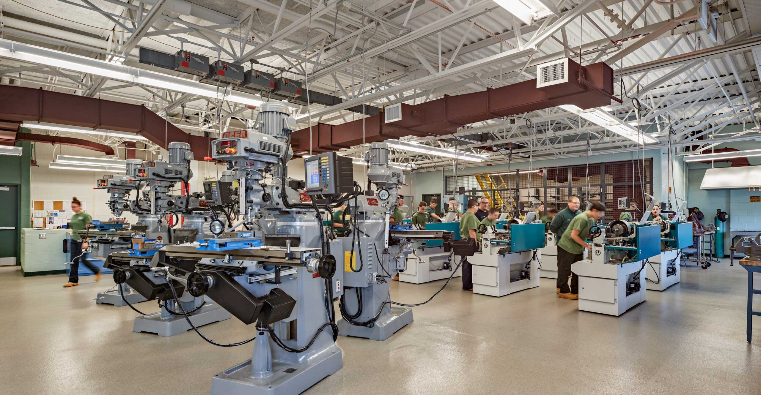 Students working on machinery at a vocational technical high school.