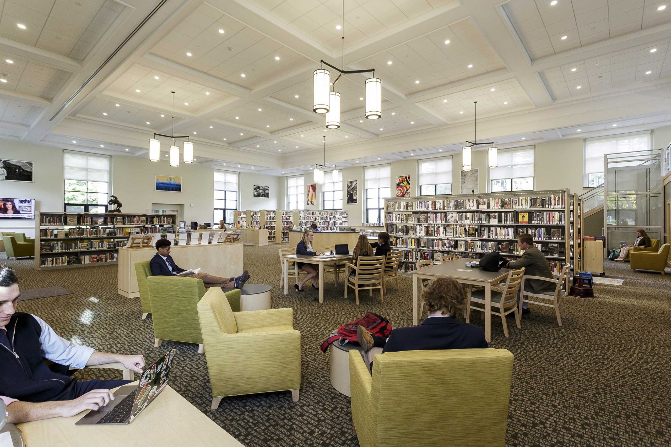 Students studying at desks at the Godman Dormitory and Geiger Library.