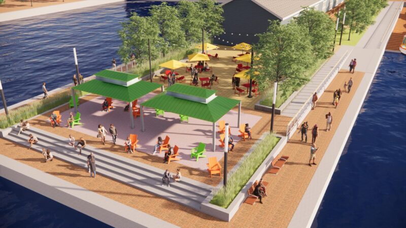 Rendering of Inner Harbor showcases a waterfront, community gathering space with plenty of seating, tables and shade structures.