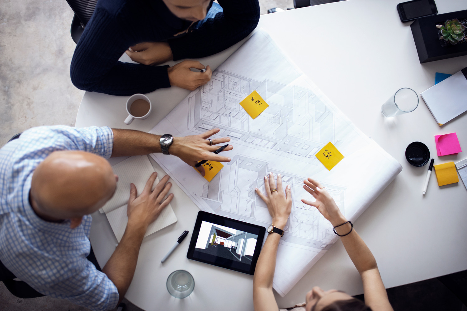 Workers reviewing and coordinating on a draft.