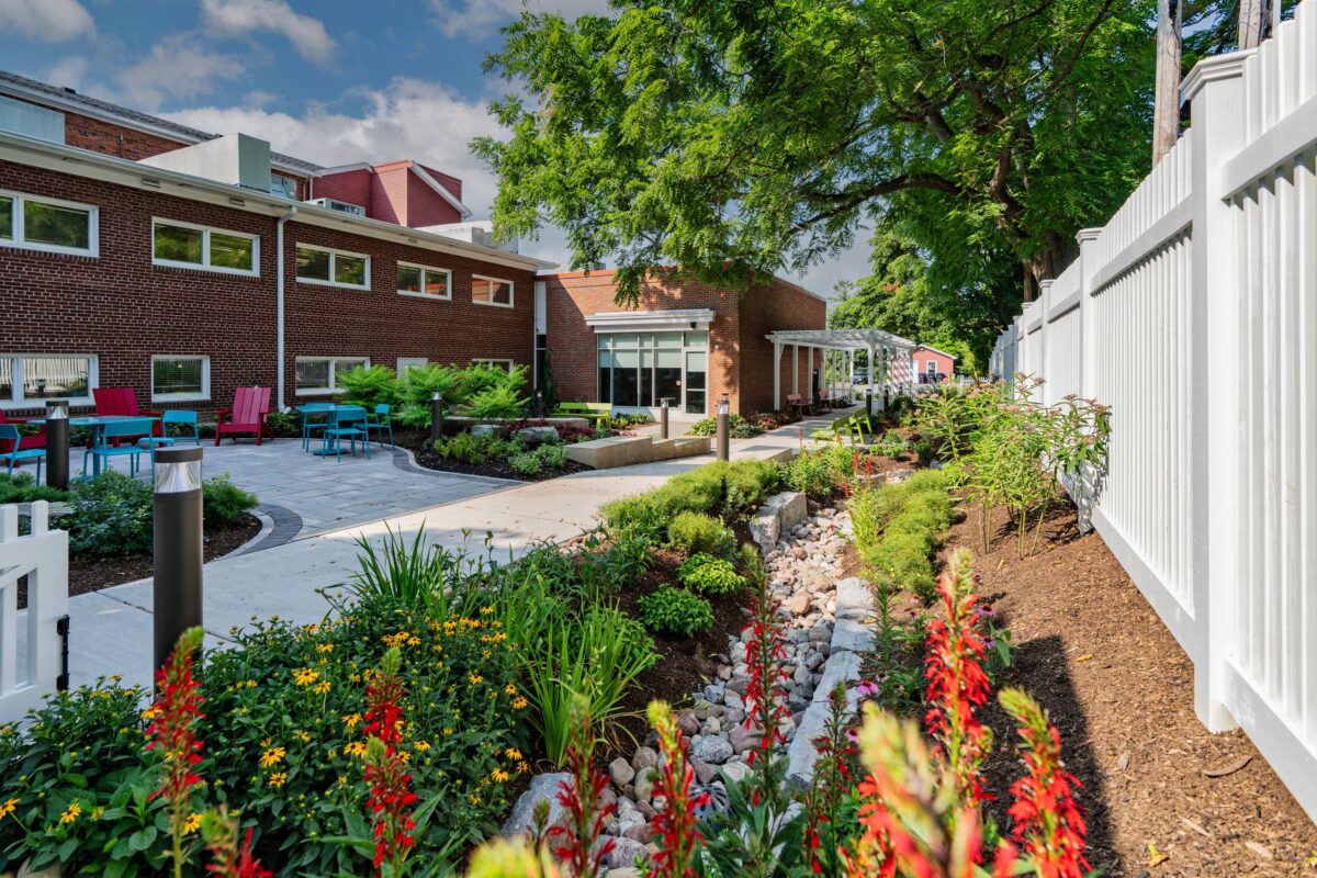 Outdoor space at Wood Library boasts stone paths, ample seating and lush gardens of plants and flowers.