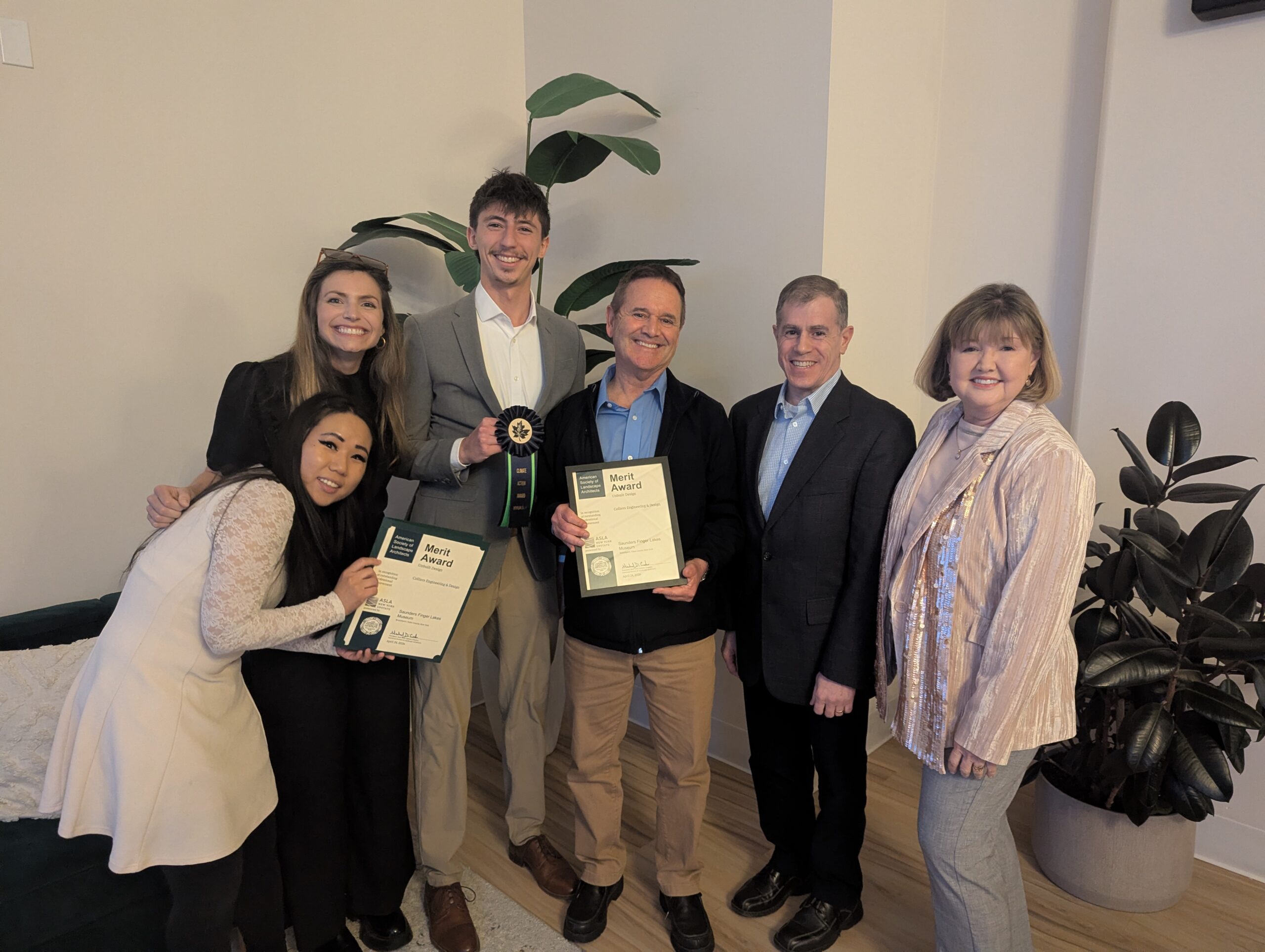 Planning and Design group from Colliers Engineering & Design accepting a Merit Award and Climate Action Green Ribbon at the 2026 New York Upstate ASLA Annual Reception and Awards Celebration.