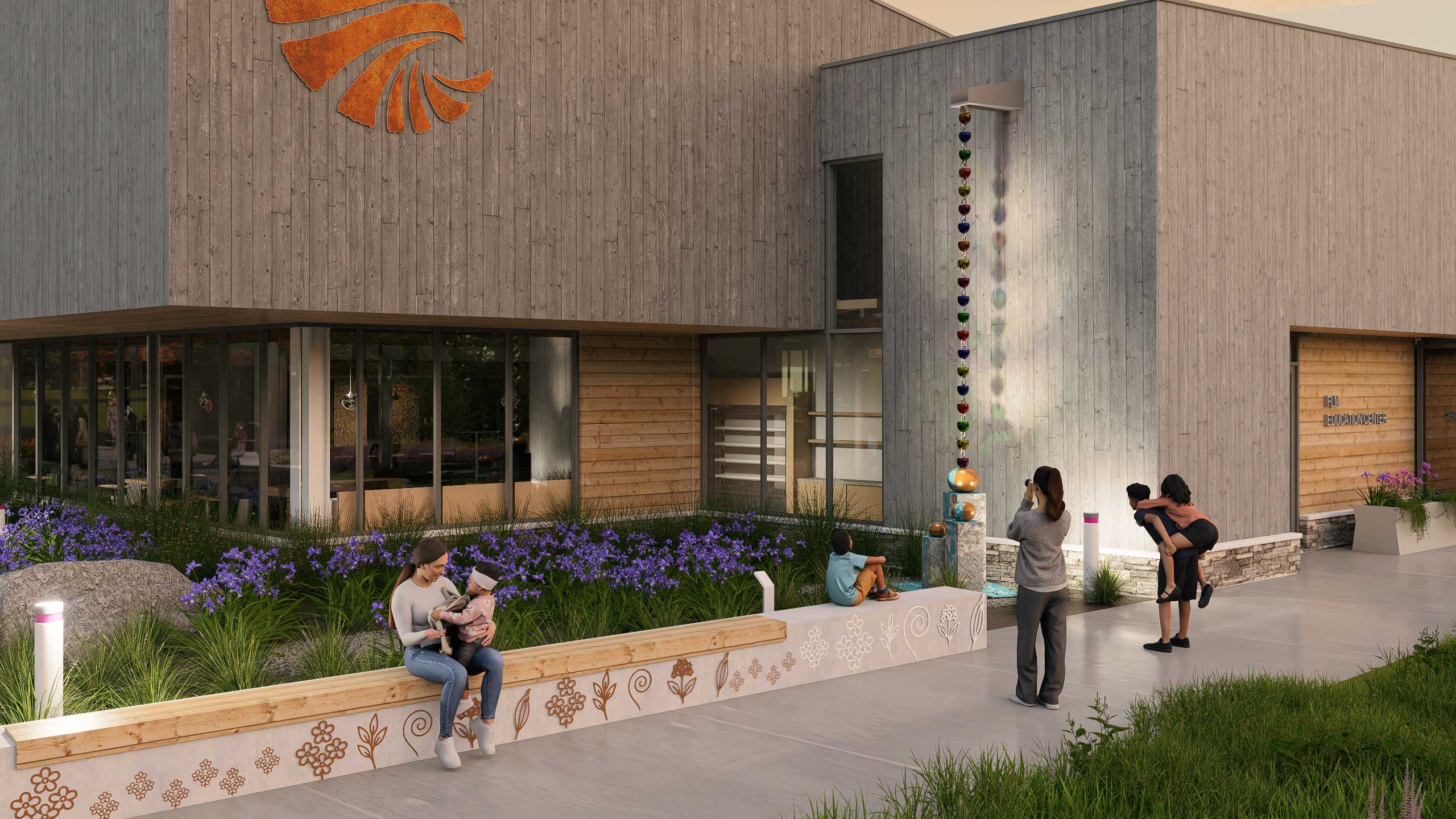 Front corner of the Saunders Finger Lakes Museum showing visitors admiring and taking photos of a sculpture.