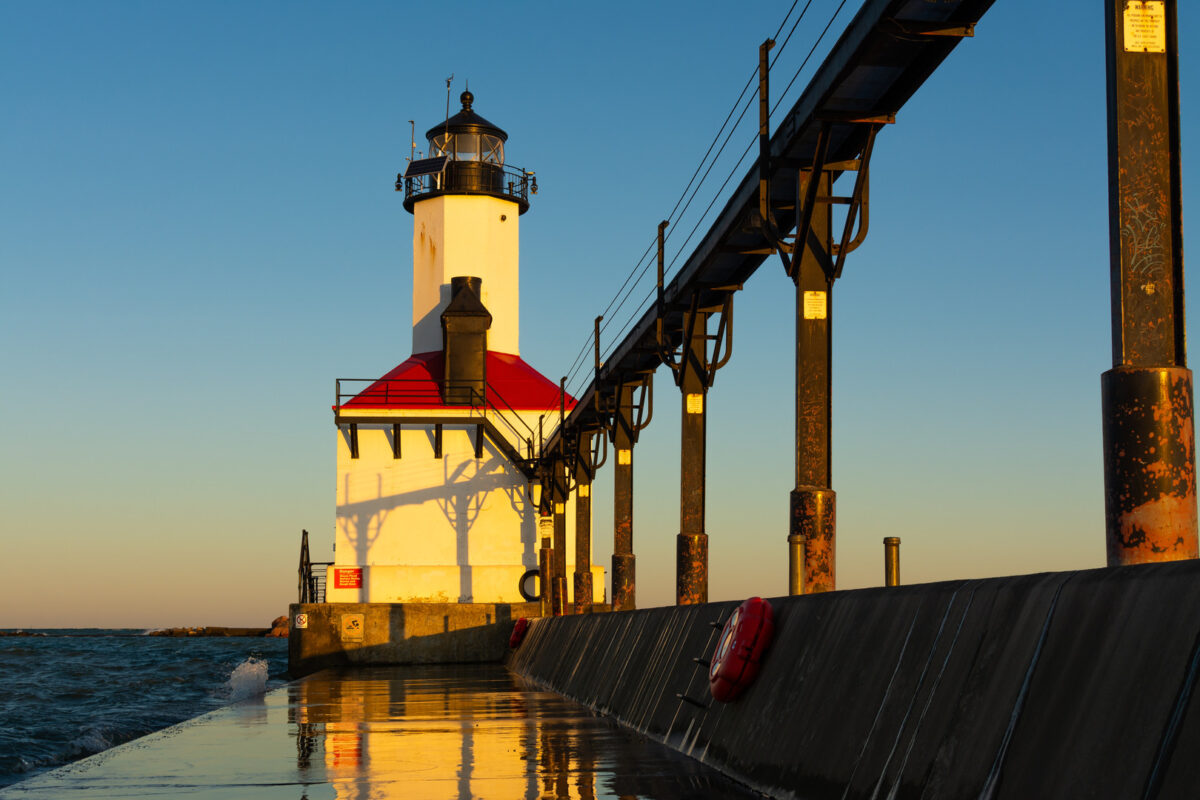 Morning sun illuminating the Michigan City Lighthouse on a beautiful Autumn morning.  Michigan City, Indiana, USA