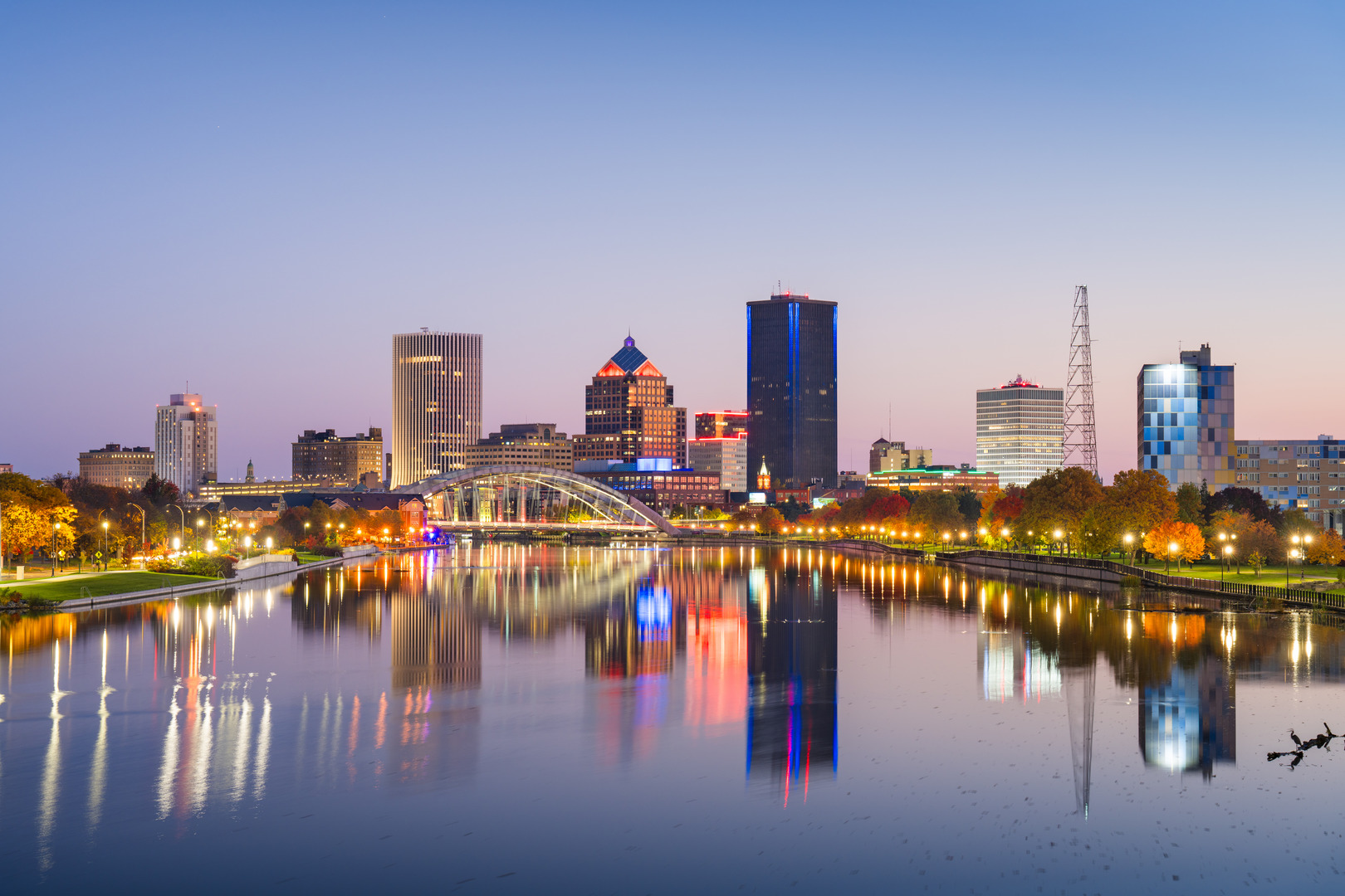 Rochester, New York, USA downtown city skyline on the Genesee River in autumn season.